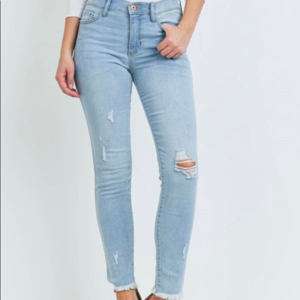 Sneak Peek mid-rise distressed skinny jeans
